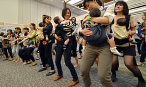 Here mothers samba dance with their babies at the Mama Fes event in Tokyo this morning. Some 50,000 parents and their babies are expected to visit the two-day event for workshops and talk-shows.