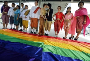 Thai activists in traditional dress take part in an event to mark International day against homophobia, biphobia and transphobia in Bangkok.