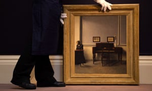 A Sotheby's employee with a painting entitled 'Ida in an Interior with Piano' 1901 by Danish artist Vilhelm Hammershoi expected to fetch £1M as part of the todaay's 19th Century European Paintings auction in London.