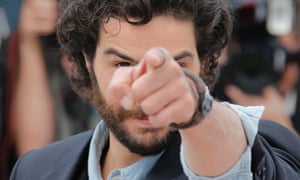 Actor Tahar Rahim points at photographers during a photo call for the film The Past during the Cannes international film festival. See more around the world in 24 hours and pictures and more from the festival here.