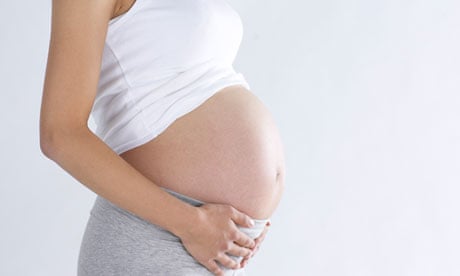 Picture of pregnant woman cropped to hide face