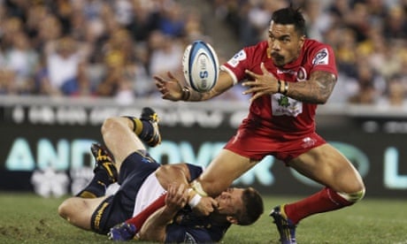 Digby Ioane of the Reds is tackled by Clyde Rathbone of the Brumbies during the round 1 Super Rugby match between the Brumbies and the Reds at Canberra Stadium