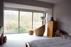 homes - bristol house: interior of bedroom with bed and floor to ceiling glass doors