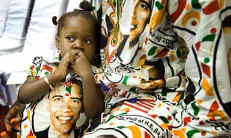 A Ghanaian girl and her father get ready to welcome Barack Obama in Accra in 2009