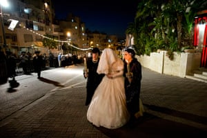 Jewish Wedding: The Ultra Orthodox Jewish bride (C) is accompanied by her relatives