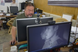 In his studio in Beijing, the artist and dissident Ai Weiwei reads comments online on the day he launched his latest project - a music video. 