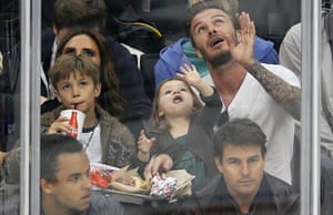 Faces in the crowd: soccer star David Beckham sits behind actor Tom Cruise with his daughter Harper, his sons and wife Victoria during Game 7 of the Western Conference semi-final hockey playoff in Los Angeles, California, last night.