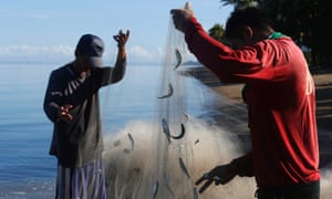 Fishermen collect their catch after fishing in Ulong Bay on Marinduque island in central Philippines.