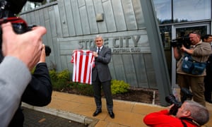 Another day, another new football manager: Stoke City manager Mark Hughes poses for a photograph during the press conference at the Clayton Wood Training Ground in Stoke-on-Trent, England.