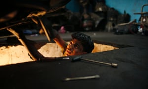 Palestinian Mohammed Jundeya, 17, works in a car repair garage in Gaza City. Jundeya left school to work as an apprentice in the garage to support his family. According to garage owners, apprentice mechanics earn around $100 per month. 