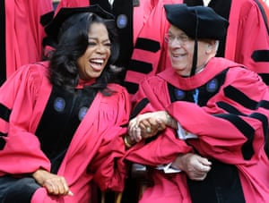 Oprah Winfrey clasps hands with Boston mayor Thomas Menino prior to receiving honorary degrees from Harvard University at commencement ceremonies in Cambridge, Massachusetts. 