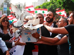 Tripoli residents release white pigeons during a march for peace and to reject the violence in northern Lebanon. The recent round of clashes in Tripoli which ended over the weekend was the heaviest in years.