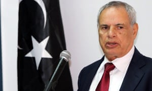 Libya's defence minister Mohammed al-Barghathi has resigned due to a crisis caused by gunmen who have besieged two ministries for more than a week.
