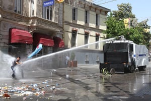 Rioting in Turkey: A man is sprayed with water