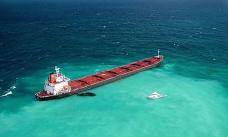 Fuel oil leaks from a Chinese bulk coal carrier grounded on the reef in 2010.