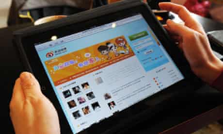 A woman views Weibo, the Chinese social media site 