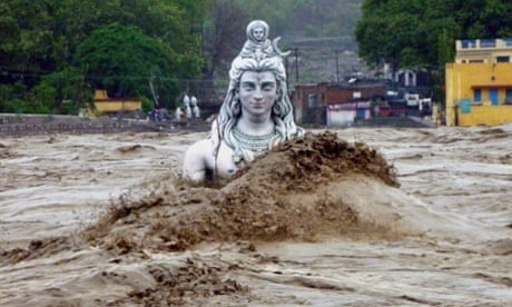 A submerged idol of Hindu Lord Shiva stands in the flooded River Ganges in Rishikesh, in Uttarakhand, India. Monsoon torrential rains have caused havoc leading to flash floods, cloudbursts and landslides as the death toll continues to climb and more than 1,000 pilgrims bound for Himalayan shrines remain stranded.