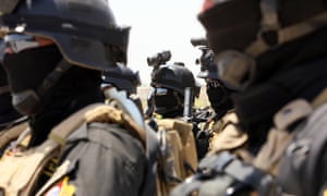 Iraqi special forces take part in a drill simulating a hostage rescue operation at an Iraqi army base North of Baghdad.