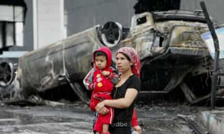 A Uighur woman and child in Urumqi after the 2009 violence.