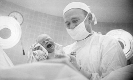 Helen Brush Jenkins photographs her newborn baby, Gilmer, in 1953. The photo was later published in 