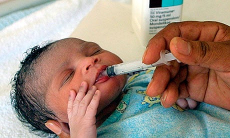 A newborn baby girl receives an antiretroviral drug right after birth in a South African hospital