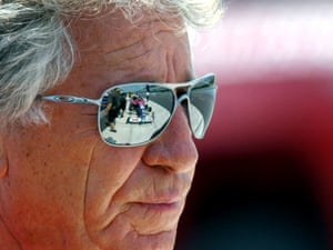 The #25 Andretti Autosport race car is reflected in Mario Andretti's sunglasses during IndyCar testing, at Pocono Raceway in Long Pond, United States.