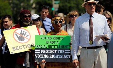 Supporters of the Voting Rights Act listen to speakers outside the Supreme Court
