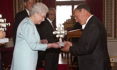 Tim Berners-Lee receives his award from the Queen