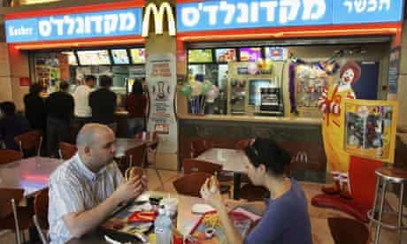 Israelis eat at a kosher McDonald's restaurant  in Tel Aviv