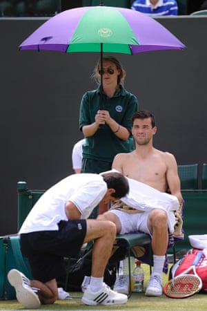 Another injury: Grigor Dimitrov is treated by the physio in his match on Court 3 today during Wimbledon 2013 day four.