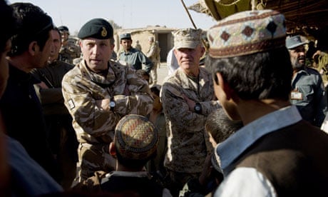General Nick Carter (L) chats with Afgan men in Helmand province in Afghanistan in 2009
