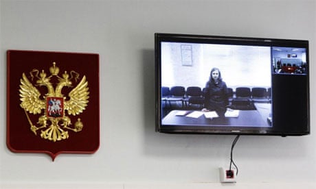 Pussy Riot Maria Alyokhina on a monitor inside the courtroom during a hearing in Berezniki