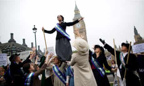 Feminist activists dressed suffragettes