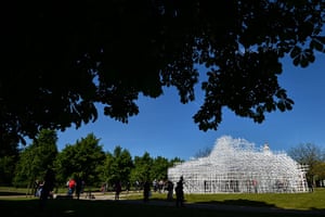 Serpentine pavilion: People take pictures of Sou Fujimoto's pavilion. The Serpentine gallery roo