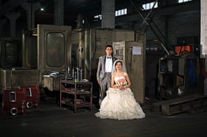 Love on the assembly line: Guanfu Chen and his wife Zhimin Lin pose for a photo at the Shanghai Ying F