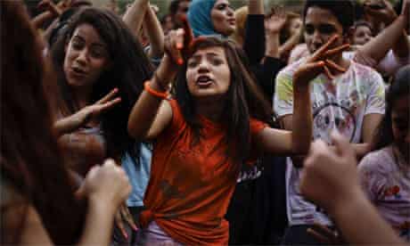 Egyptian girls dance at a festival 