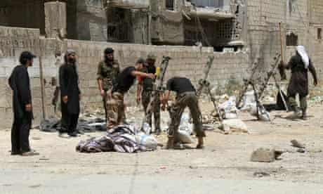 Syrian rebel fighters prepare their weapons in the capital Damascus