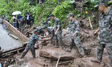 Rescuers clear debris at flood-hit Huiwang village, China