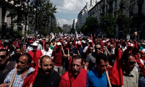 Greek communist union PAME members shout slogans against the Greek government during a general strike in Athens on July 16, 2013.