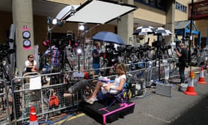 An American Network Broadcaster waits in a Union Jack chair outside the Lindo wing of St Mary's Hospital as the media prepares for the birth of the first child of the Duke and Duchess of Cambridge in London, England.
