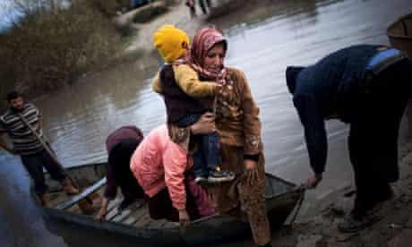 Syrian refugees cross the Orontes river to Hacipasa village, Turkey