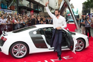 Hugh Jackman arrives in an Audi Spyder R8 for the UK Premiere of The Wolverine, at a central London cinema in Leicester Square. Photograph: Joel Ryan/Invision/AP