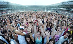 Fans of Italian rapper, singer and songwriter Jovanotti cheer during his concert at Olimpico stadium in Turin, Italy.