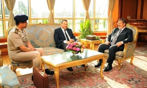 The Egyptian Presidency has released this photograph of Mohamed Morsi, and his prime minister Hesham Qandil meeting the head of the army Abdel-Fattah el-Sisi, left in Cairo.