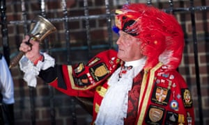 A Town Crier announces about the the birth of the royal baby outside St Mary's hospital in London.