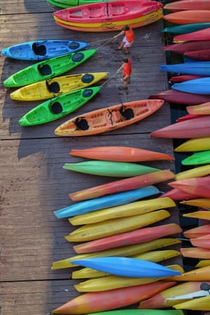A bird's-eye view shows a rainbow of rental kayaks at a Potomac River boat house in Washington. A break in the heatwave in the US capital has made for more temperate boating.