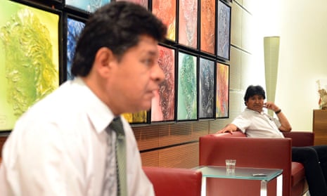 Bolivian defence minister Ruben Saavedra Soto (L) and Bolivian President Evo Morales sit in a waiting lounge in Vienna airport