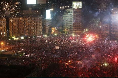 Fireworks and shouts of joy emanate from Tahrir Square after a broadcast by the head of the Egyptian military confirming that they will temporarily be taking over from the country's first democratically elected president Mohammed Morsi on July 3, 2013 in Cairo, Egypt.