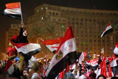 Protesters, who are against Egyptian President Mohamed Mursi, react in Tahrir Square in Cairo July 3, 2013.