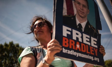 A supporter of Bradley Manning protests outside the main gate before the reading of the verdict in Manning's military trial at Fort Meade.